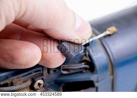 Carbon Brushes Isolated On A White Background. Brushes For Electric Motor.spare Parts For Angle Grin