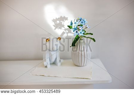 Flower Hackelia Velutina In A White Fluted Vase In The Style Of The Seventies, A Figurine Of Bear. S
