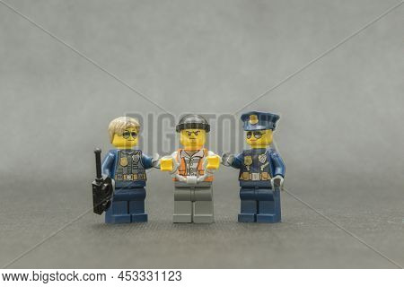 Bauru, Brazil. September 15, 2019: Lego Minifigure Of Thief In Handcuffs With Police Escorting. The 