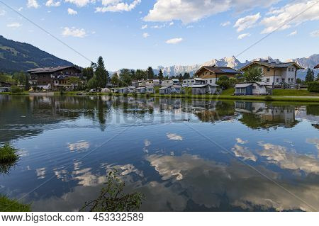 Camp On The Lake In The Mountains. Summer Active Rest In The Mountains. Camping On The Background Of
