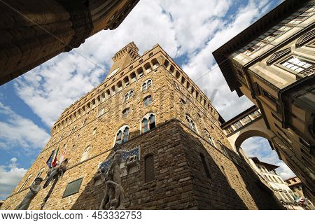 Florence, Fi, Italy - August 20, 2015: Old Palace Called Palazzo Vecchio And Replica Statue Of David