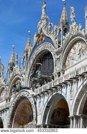 Venice, Ve, Italy - July 13, 2020: Four Horses In The Facade Of The Basilica Of St. Mark And Winged 