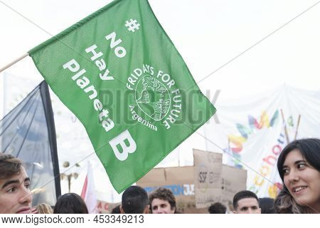 Buenos Aires, Argentina; April 22, 2022: Earth Day Demonstration, People And Flag Of The Environment