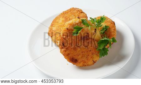 Plate With Chicken Cutlets. Fried Juicy  Cutlets On A White Plate Garnished With Parsley