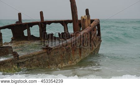View Of A Rusty Shipwreck In Habonim Beach In Stormy Day.  Habonim Shore, Israel