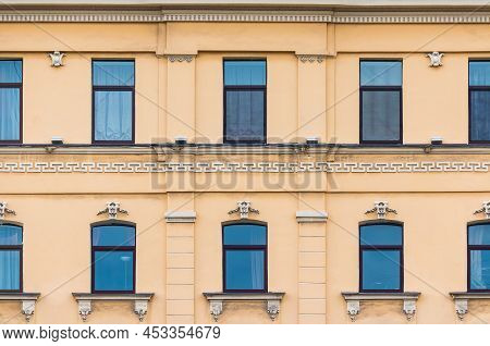 Many Windows In A Row On The Facade Of The Urban Historic Apartment Building Front View, Saint Peter