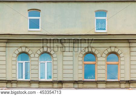 Several Windows In A Row On The Facade Of The Urban Historic Apartment Building Front View, Saint Pe