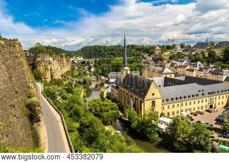 Panoramic View On Abbaye De Neumunster And St. Jean Du Grund Church In Luxembourg A Beautiful Summer