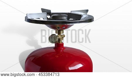 Red Metal Gas Cylinder For Lpg And Burner For Camping Stove. Isolated On White Background.