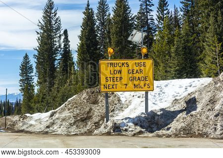 Trucks Use Low Gear Steep Grade Road Sign In The Mountains