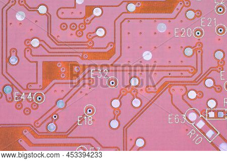Hard Drive Hdd Printed Wiring Board Pwb Close-up. Conductive Patterns. Pink Pc Background. Tinted Co