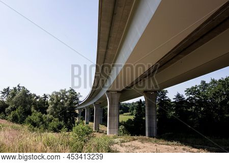 Bottom View Of Modern Highway Bridge With Concrete Pillars As A Way Of Fast Transportation