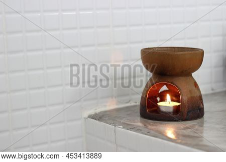 Brown Ceramic Candle Aroma Oil Lamp In The Toilet
