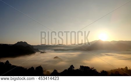 The Sunrise And The Mountain Cover With The Fog