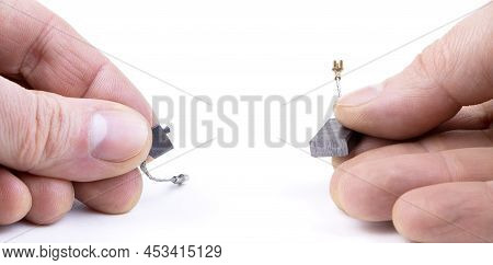 New And Old Carbon Brushes Isolated On A White Background. Brushes For Electric Motor.spare Parts Fo