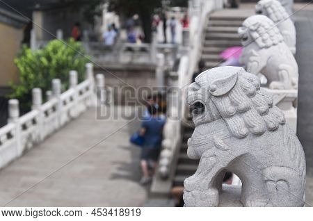 Chinese Lion Statues Overlooking A Courtyard Within Jinshan Temple In Zhenjiang China, Jiangsu Provi