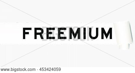 Ripped Gray Paper Background That Have Word Freemium Under Torn Part