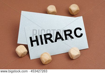 The Concept Of Industrial Safety. On A Brown Surface, Wooden Cubes And A Business Card With The Insc