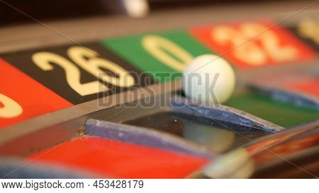 Ball On Wooden French Roulette Table In Casino. Wheel Spinning, Turning Or Rotating. Odd And Even Nu