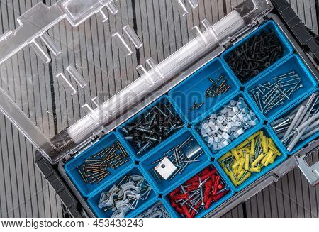 Variety Of Wall Plugs Or Rawlplug And Screws Inside A Box. Construction Industry Theme.