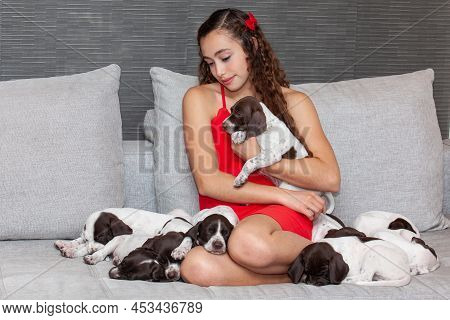Beautiful Young Girl Dressed In Red With Her Small French Braque Puppy