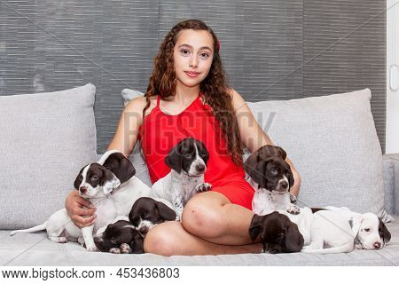 Beautiful Young Girl Dressed In Red With Her Small French Braque Puppy
