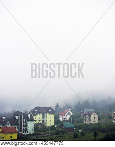Houses In The Valley In The Ukrainian Carpathians At Foggy Weather