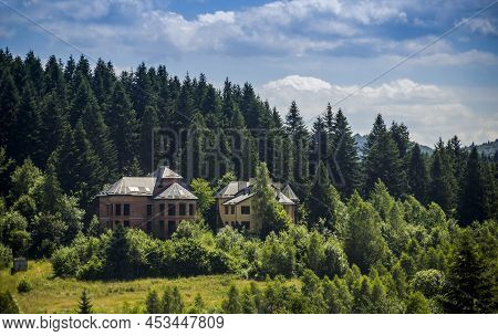Cottage And Unfinished House On The Hill Near The Spruse Forest In Carpathians, Lviv Region, Ukraine