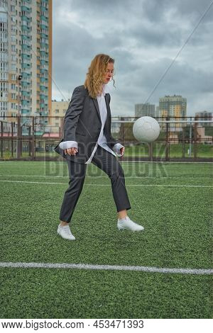 Woman Soccer Player With Ball On The Field. Ball Dribbling, Feint.