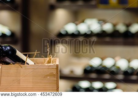 Variety Of Wine Bottles Stored In Rack In Restaurant, Closeup Photo