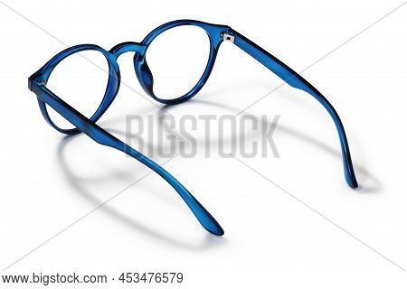 Eyeglasses In Blue Bright Color In Transparent Plastic. Eyewear Rear View With Shadow. Trendy Glasse