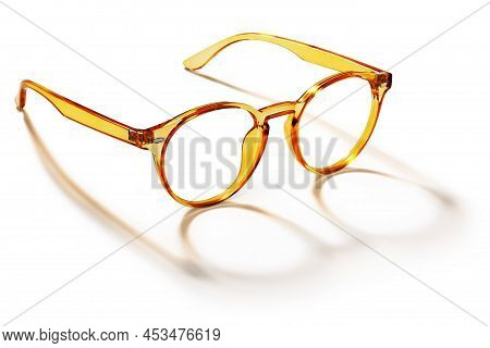 Eyeglasses In Orange Golden Bright Color In Transparent Plastic. Eyewear Side View With Shadow. Tren