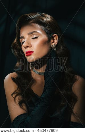 Portrait Of Young Woman In Hollywood Retro Noir Style. A Beautiful Brunette Girl With A Hairstyle An