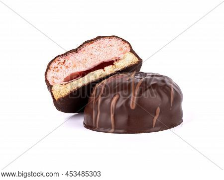 Closeup Sweet Dessert Souffle In Chocolate With Pink Filling. Cutaway Souffle On A Whole Souffle Ove