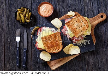 Reuben Sandwich With Rye Bread Thinly Sliced Corned Beef, Sauerkraut, Russian  Dressing And Melted C
