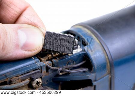 Carbon Brushes Isolated On A White Background. Brushes For Electric Motor.spare Parts For Angle Grin