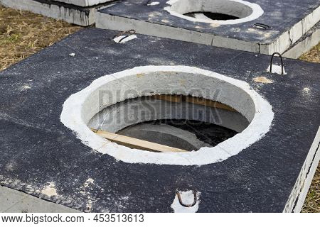 Reinforced Concrete Slabs At A Construction Site Against A Blue Cloudy Sky And Earth. Folded Plates 