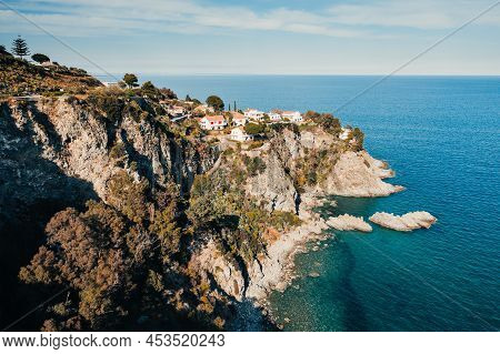 Pietragrande Cliff In Summer Season With Blue Ionic Sea And Rocks In The Calm Water. Aerial Shoot In