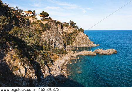 Pietragrande Cliff In Summer Season With Blue Ionic Sea And Rocks In The Calm Water. Aerial Shoot In