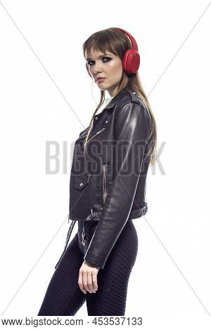 Lifestyle Ideas. Relaxed Winsome Young Caucasian Female In Sport Fitness Outfit And Leather Jacket P