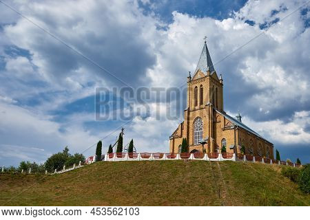 Old Ancient Catholic Temple Of Assumption Of The Virgin Mary In  Krasnoe Village, Molodechno Distric