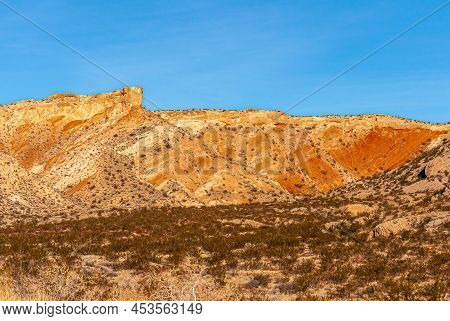 Overton, Nevada, Usa - February 24, 2010: Valley Of Fire. Orange-yellow Mountain Range Forms A Blet 