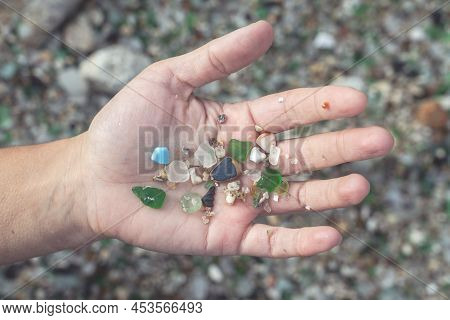 Woman Hands Holding Colored Crystals Eroded By The Sea In The Beach Of The Crystals In The Silleiro 