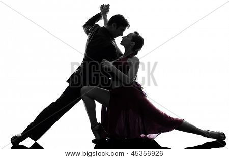 1 つの白人カップル男女性社交ダンサー白 bac に分離されたシルエット スタジオで tangoing