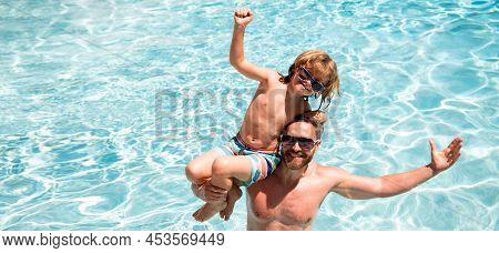 Father And Son In Pool. Pool Resort. Boy With Dad Playing In Swimming Pool. Active Lifestyle Concept
