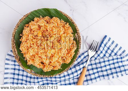 Sweet And Sour Crispy Noodles Or Mee Krob In The Thai Language On A Dish With Cutlery And Cloth Plac