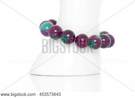 Ruby Zoisite Bracelet On A White Display Stand. Collection Of Natural Gemstones Accessories. Studio 