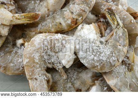 Freezer Burned Shrimp In The Shell Coated With Ice Crystals From Improper Packaging Or Refrigeration