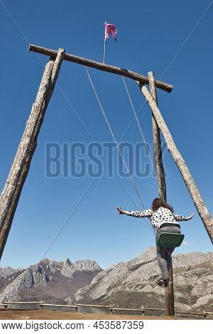 Huge Swing Surrounded By Mountains In Riano Village. Spain