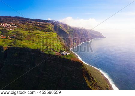 Aerial View Of The Ponta Do Pargo Lighthouse Located On A Massive Cliff In The Madeira Islands, Port